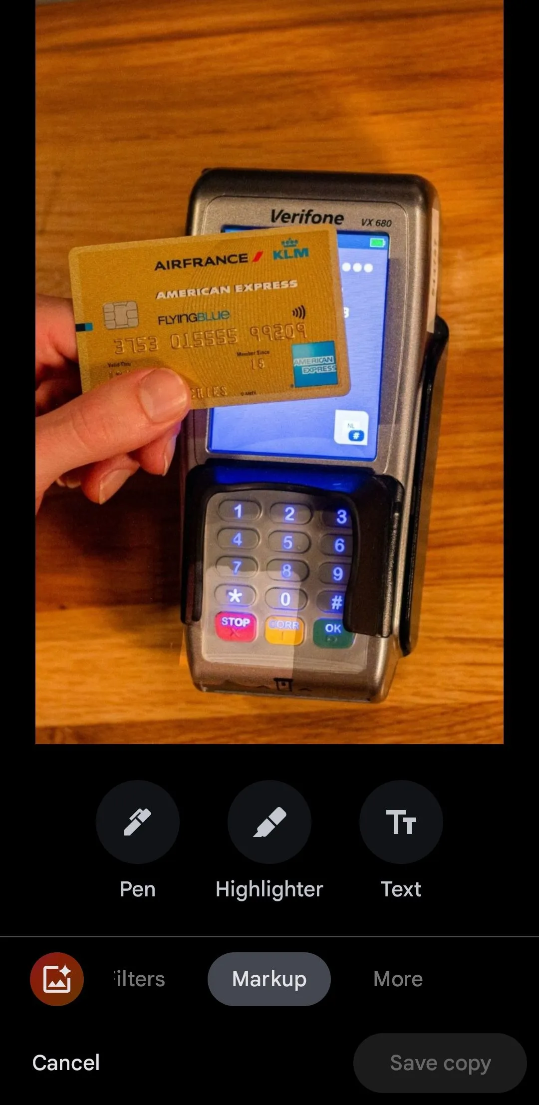 Google Photos app showing photo of a credit card with Markup tool selected