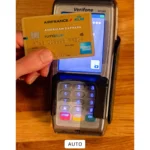 iPhone Photos app showing photo of a credit card