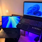 Laptop Windows 11 và MacBook Pro, minh họa tốc độ khởi động nhanh của các PC hiện đại nhờ ổ SSD