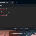 Màn hình máy tính hiển thị script AutoHotkey để tắt tiếng hệ thống nhanh chóng và biểu tượng âm thanh đang bị tắt.
