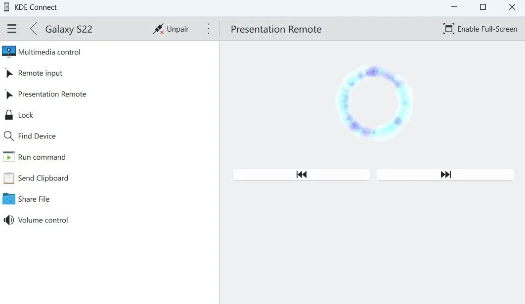 Màn hình máy tính Windows hiển thị chế độ điều khiển thuyết trình của KDE Connect, với con trỏ laser ảo màu xanh.
