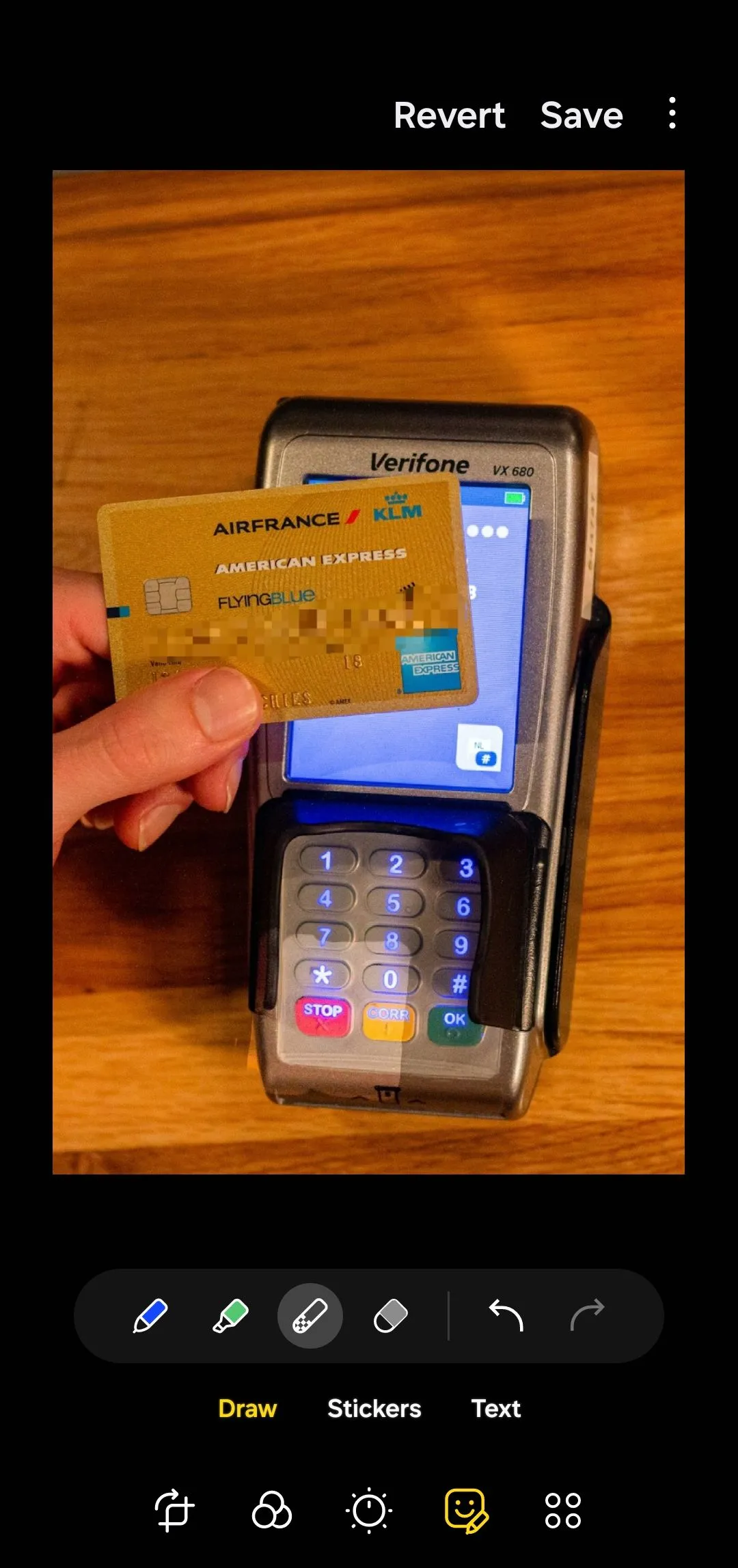 Samsung Gallery app photo editor showing an image of a credit card with numbers blurred
