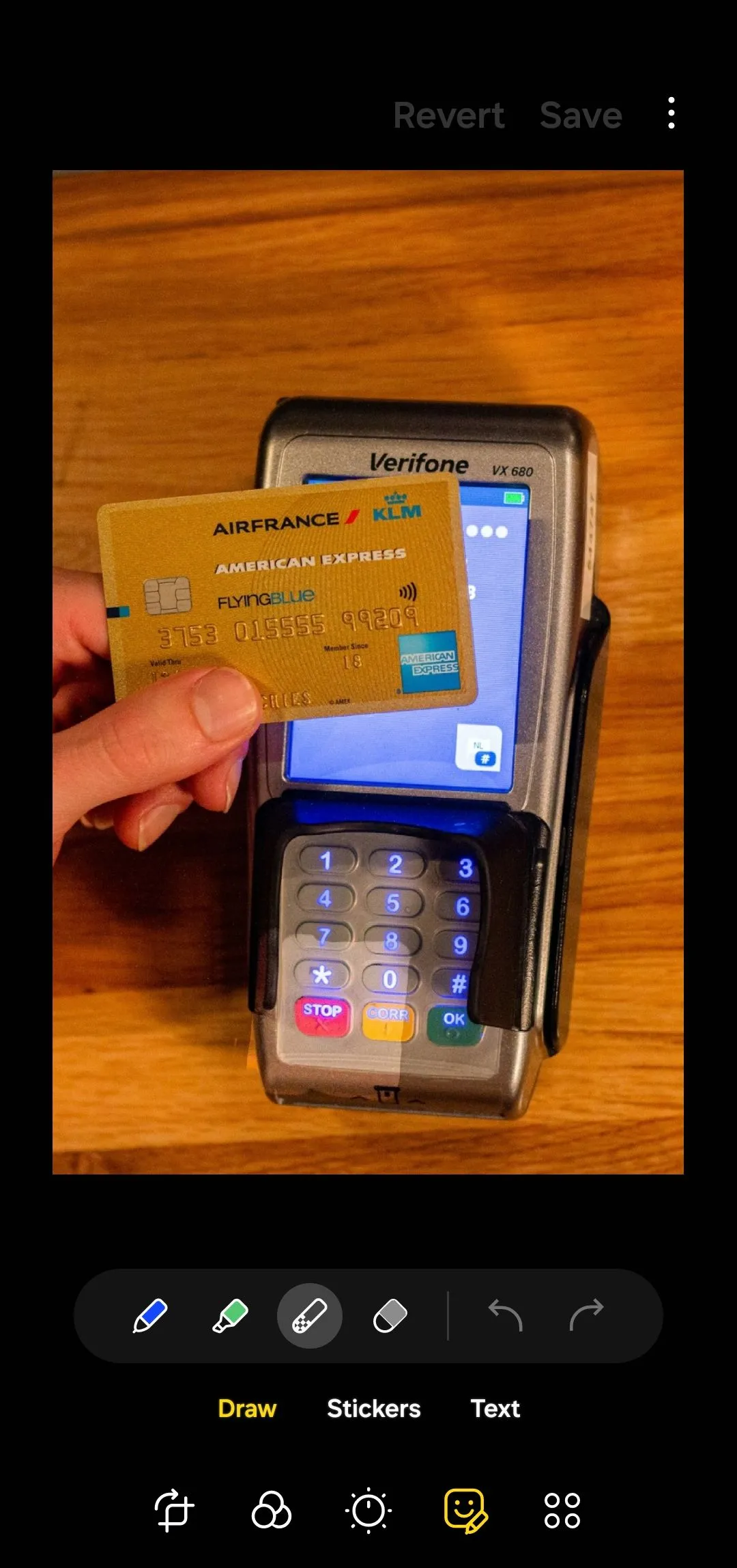 Samsung Gallery app photo editor with an image of a credit card