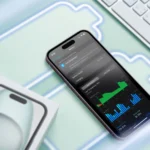 An iPhone on a surface with some battery icons and the screen showing battery usage.