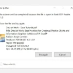 Màn hình thông báo lỗi "The action can't be completed because the file is open in another program" trên Windows 10 khi cố xóa file PDF đang mở.